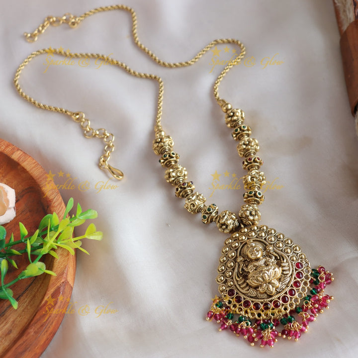 Stunning Lakshmi carved pendant gold beads haram with ruby emerald and pink beads