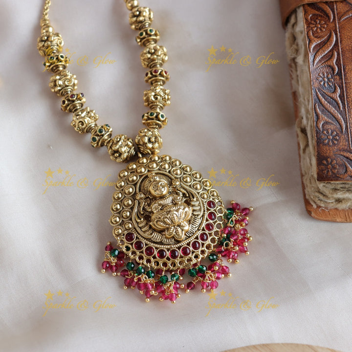 Stunning Lakshmi carved pendant gold beads haram with ruby emerald and pink beads