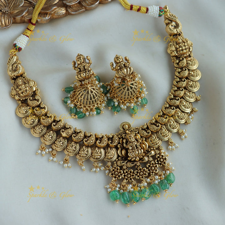 Stunning Lakshmi peacock carved coin short necklace with mint green beads