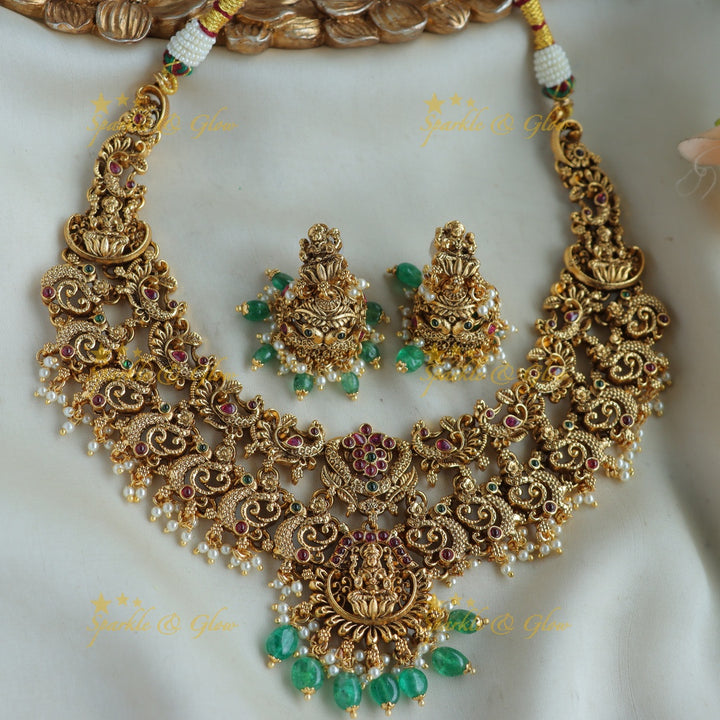 Grand Intricaate Lakshmi peacock carved short necklace with ruby emerald and mint green beads