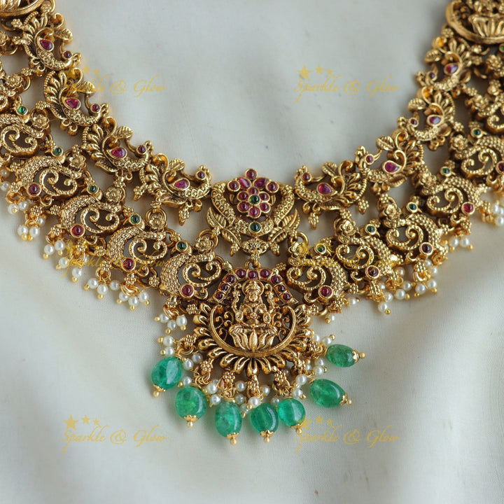 Grand Intricaate Lakshmi peacock carved short necklace with ruby emerald and mint green beads