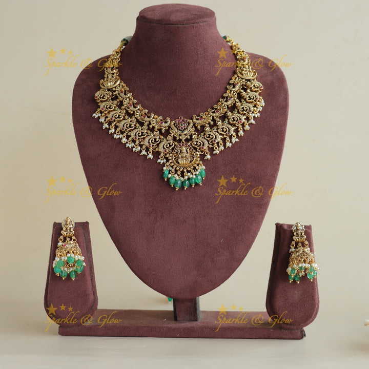Grand Intricaate Lakshmi peacock carved short necklace with ruby emerald and mint green beads