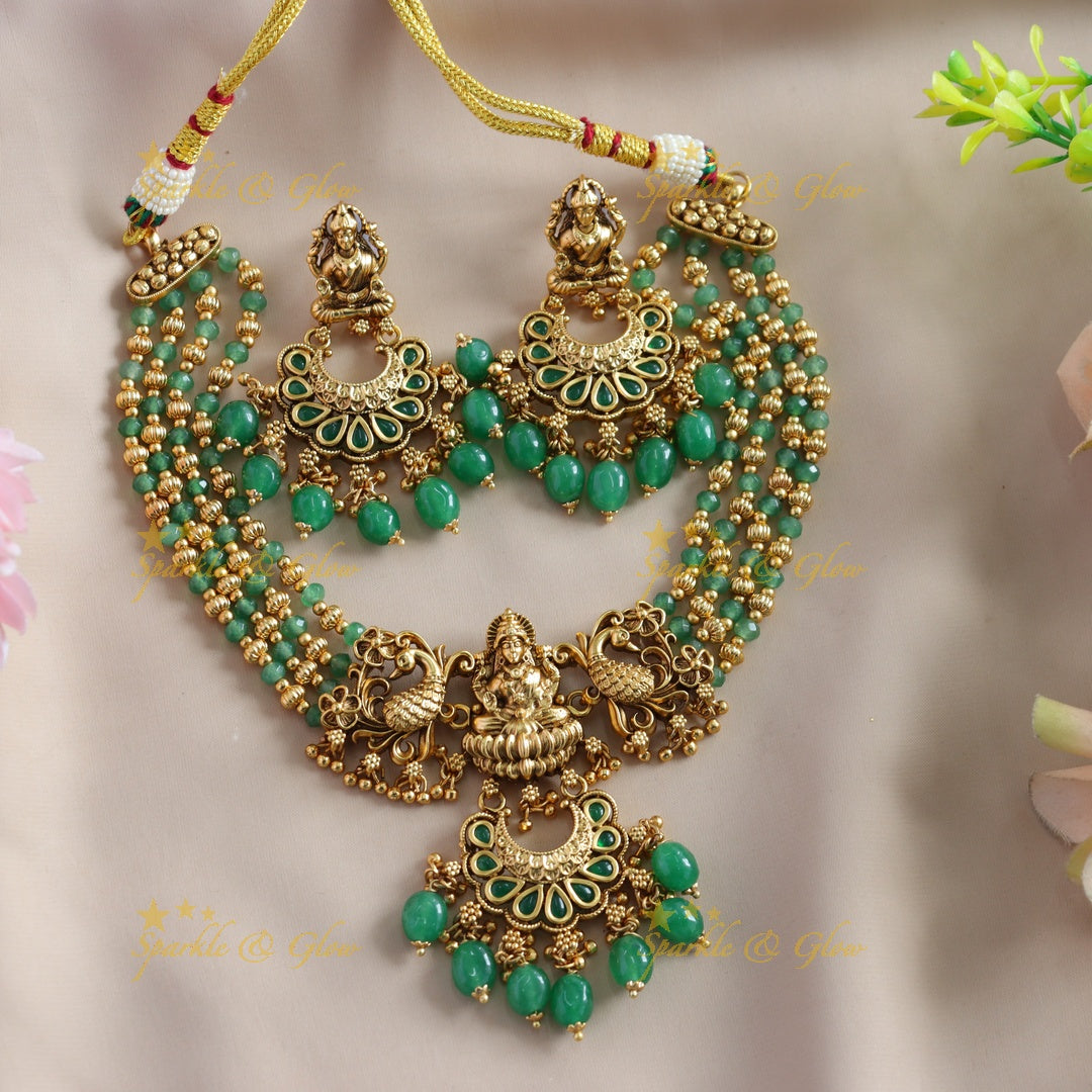 Stunning Lakshmi Peacock carved choker with multi layer gold and mint green beads