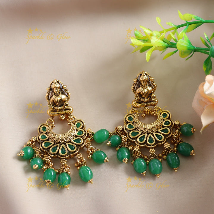 Stunning Lakshmi Peacock carved choker with multi layer gold and mint green beads
