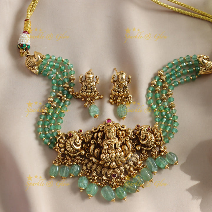 Beautiful Lakshmi Peacock carved choker with multi layer gold and mint green beads