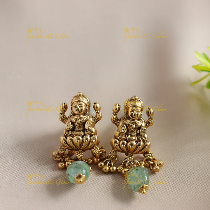 Beautiful Lakshmi Peacock carved choker with multi layer gold and mint green beads