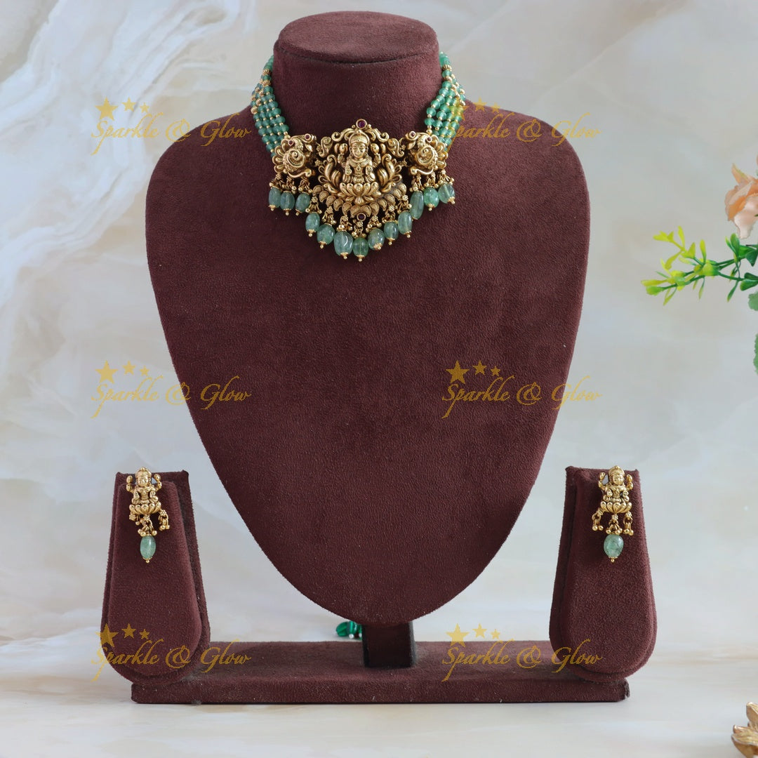 Beautiful Lakshmi Peacock carved choker with multi layer gold and mint green beads