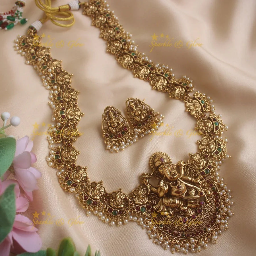 Stunning Ganesha carved long necklace with ruby stones and pearls - red pearl - Sparkle and Glow