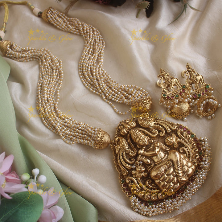 Statement Krishna playing flute and peacock carved haram with multi layer gold and pearl chain