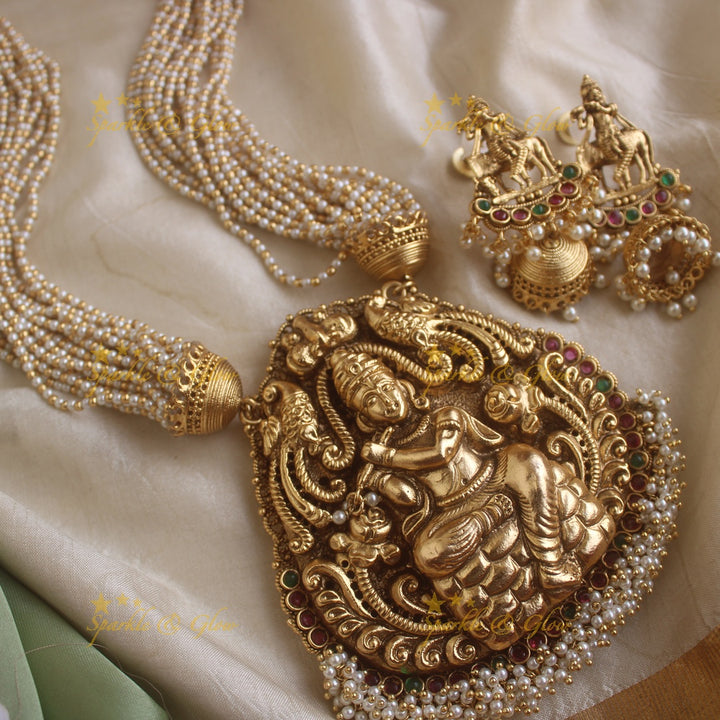 Statement Krishna playing flute and peacock carved haram with multi layer gold and pearl chain