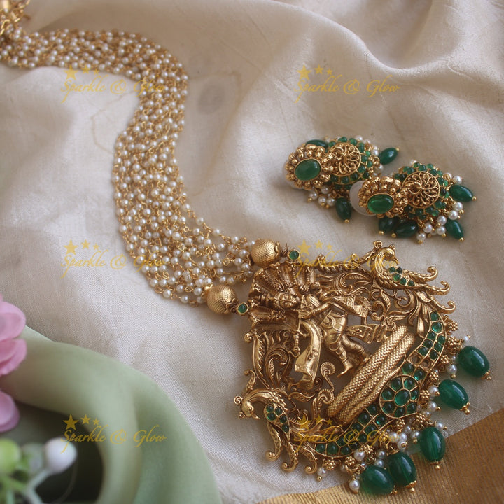Exquisite Kalinga Mardhan Krishna carved pendant haram with emerald multi layer pearl chain and green beads