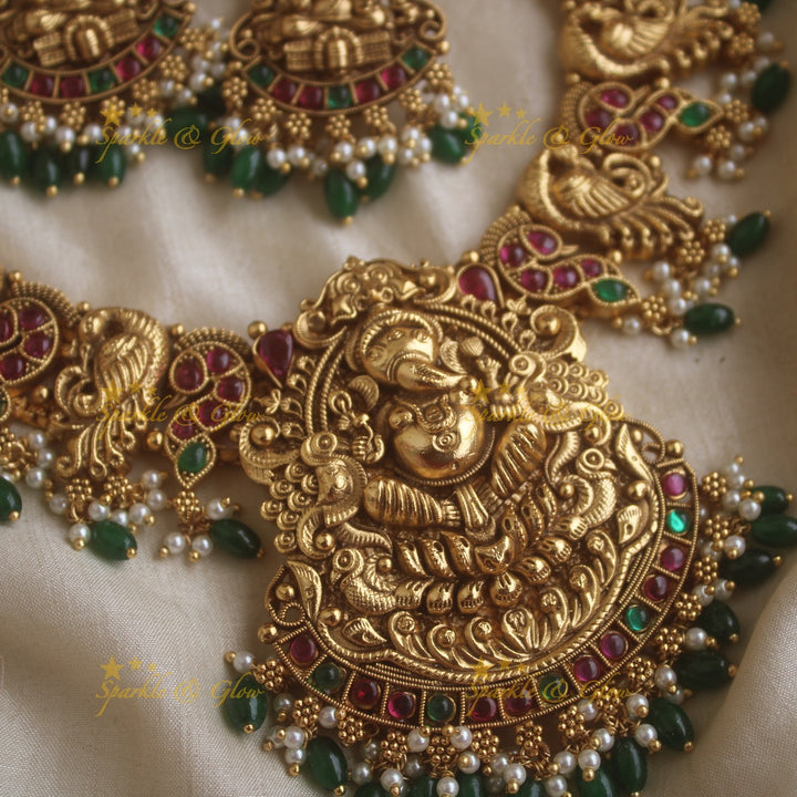 Grand Intricate Ganesha peacock carved short necklace with ruby emerald stones pearls and green beads