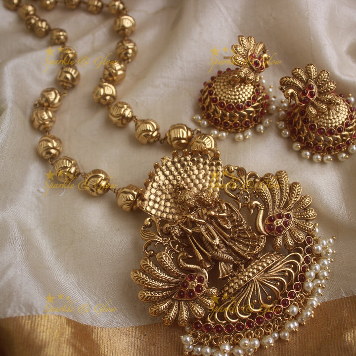 Stunnin Radha Krishna pendant gold beads haram with ruby stones and pearls