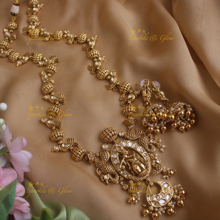 Elegant Krishna playing flute and parrot design long necklace with pearls and gold beads
