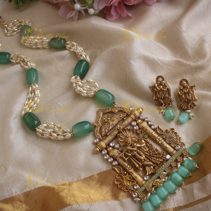 Grand Radha Krishna carved pendant haram with multi layer pearl and mint green beads chain