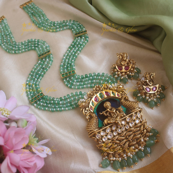 Statement Krishna Playing flute and peacock carved pendant haram with multi layer mint green beads chain and stones