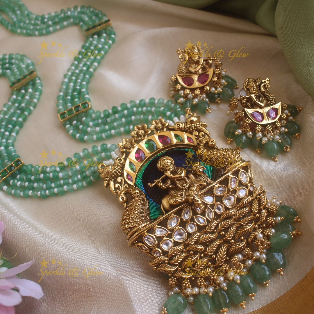Statement Krishna Playing flute and peacock carved pendant haram with multi layer mint green beads chain and stones