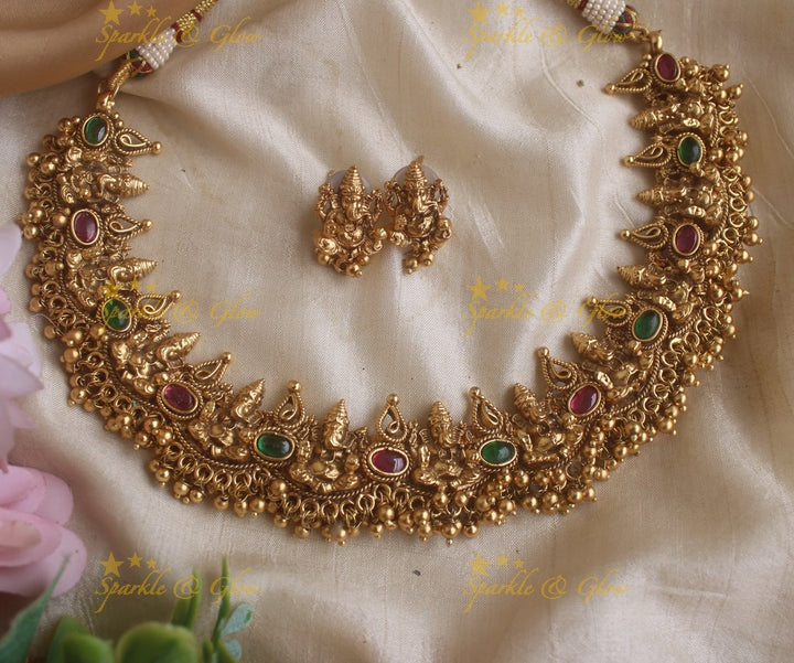 Elegant Idol Ganesha and Leaf design short necklace with gold beads