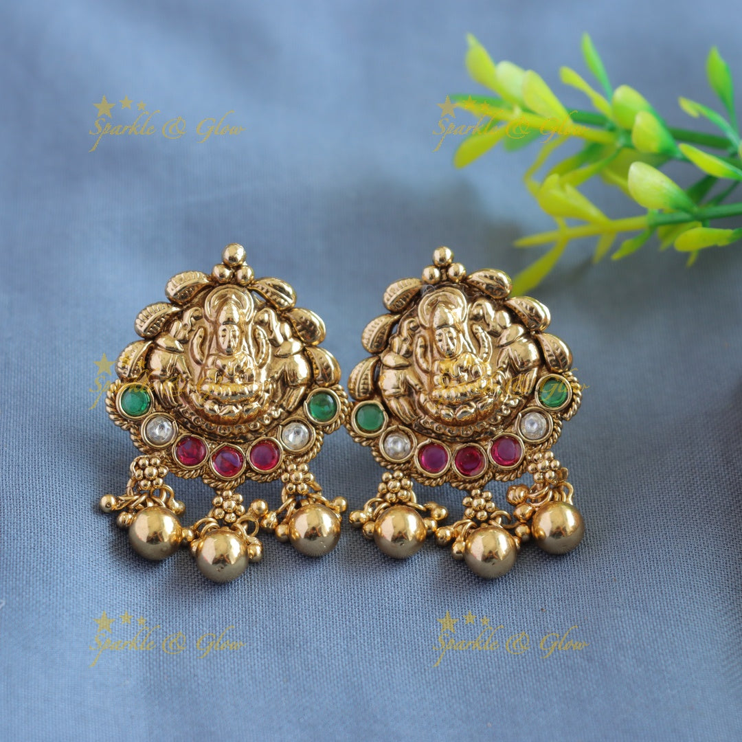 Gorgeous Lakshmi peacock carved pendant haram with multi layer gold and mint green beads
