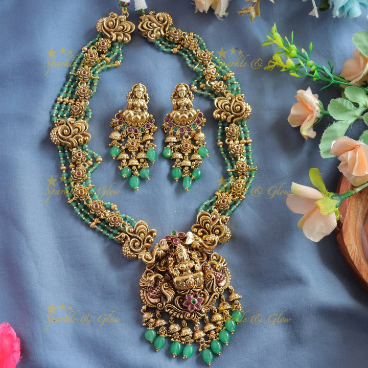 Elegant Lakshmi peacock floral design haram with multi layer gold and mint green beads