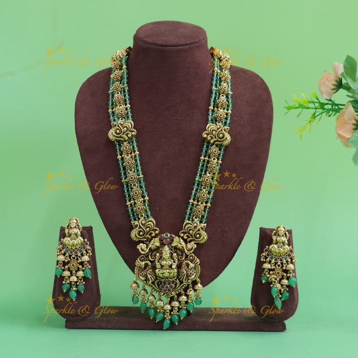 Elegant Lakshmi peacock floral design haram with multi layer gold and mint green beads