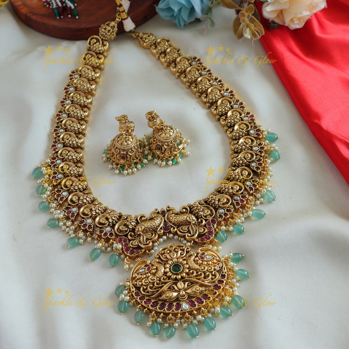 Beautiful Peacock carved long necklace with ruby emerald pearls and mint green beads