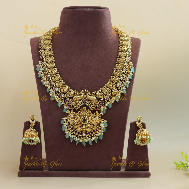 Beautiful Peacock carved long necklace with ruby emerald pearls and mint green beads