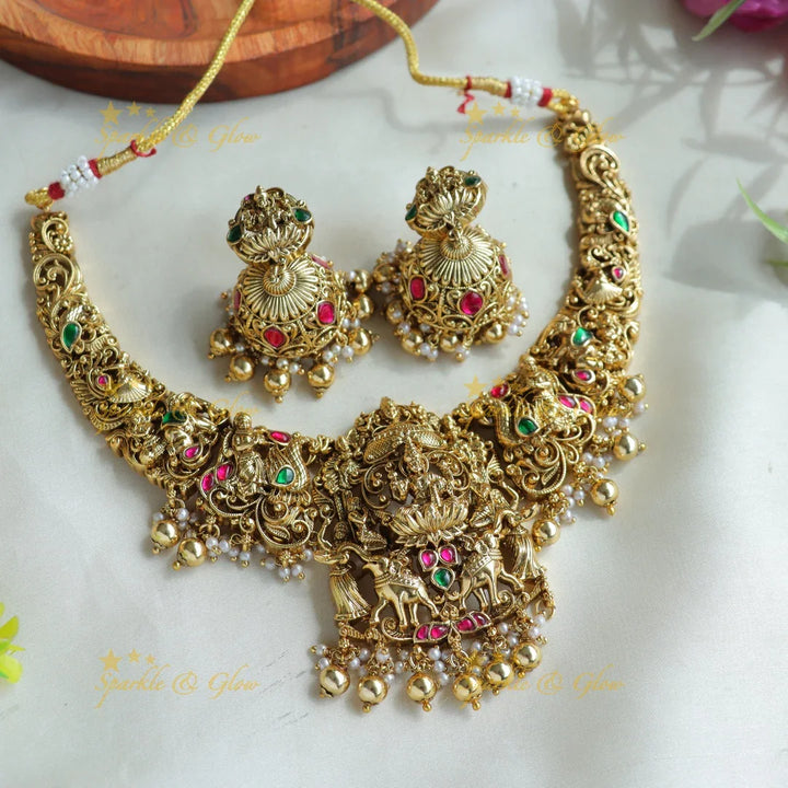 Beautiful Lakshmi Elephant peacock carved jadau short necklace with green beads - Sparkle and Glow