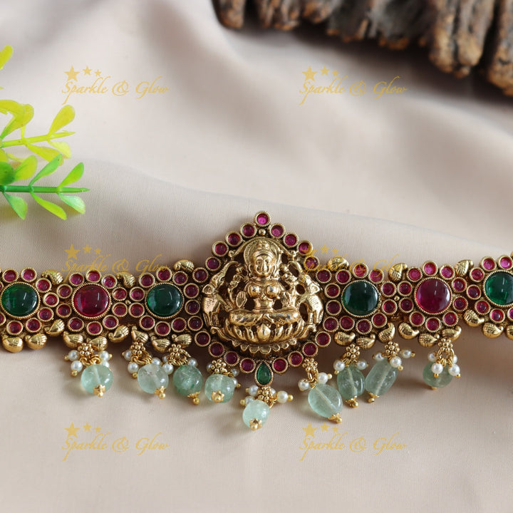 Elegant Lakshmi Floral design choker with ruby emerald stones and mint green beads