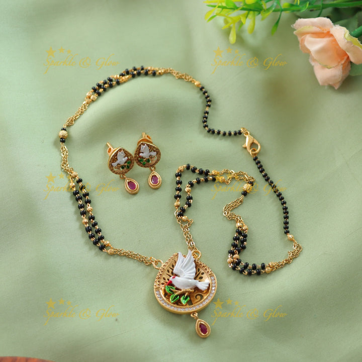 Statement Pigeon design pendant two layer black beads chain , mangalsutra with ruby and white stones