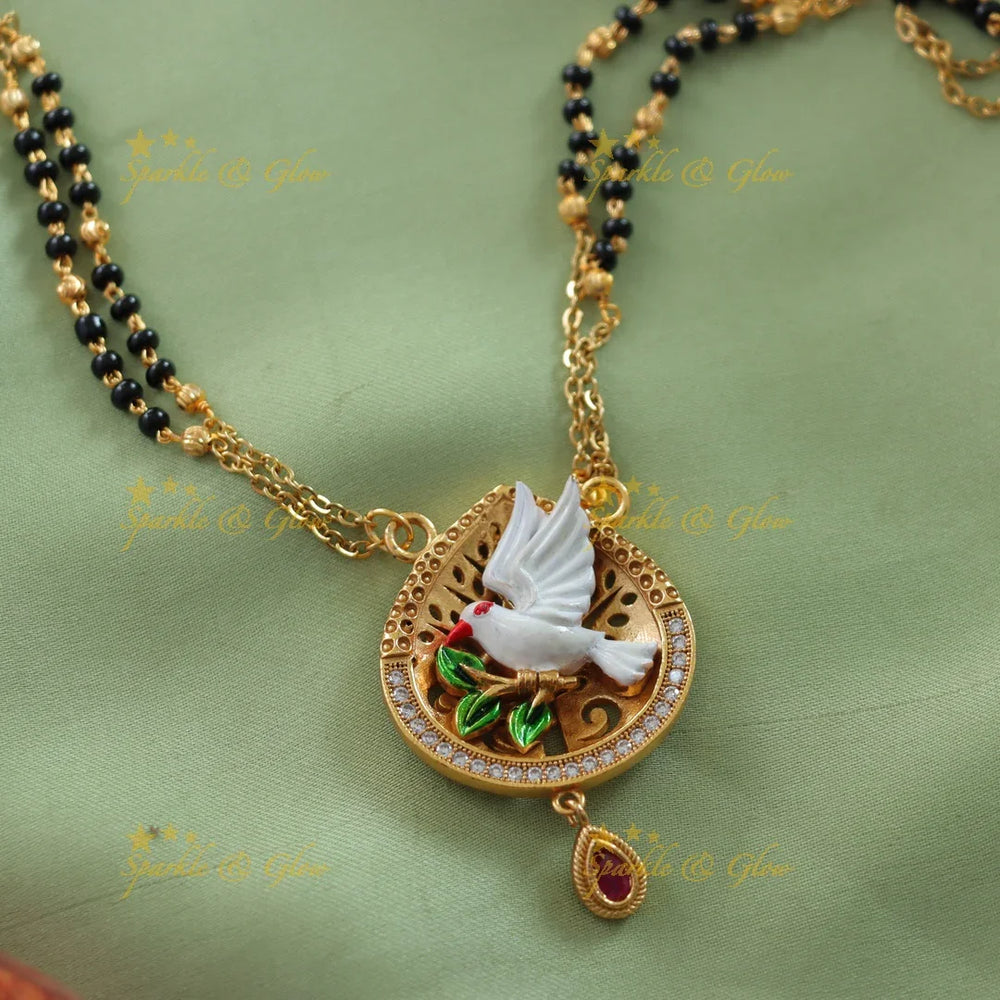 Statement Pigeon design pendant two layer black beads chain , mangalsutra with ruby and white stones - Sparkle and Glow