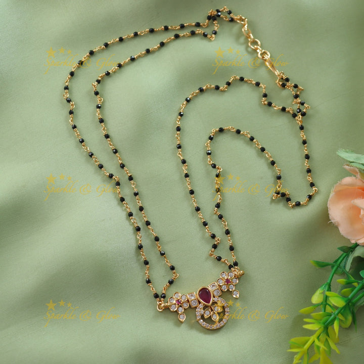 Elegant Floral design stone pendant two layer black beads chain , mangalsutra with emerald - green