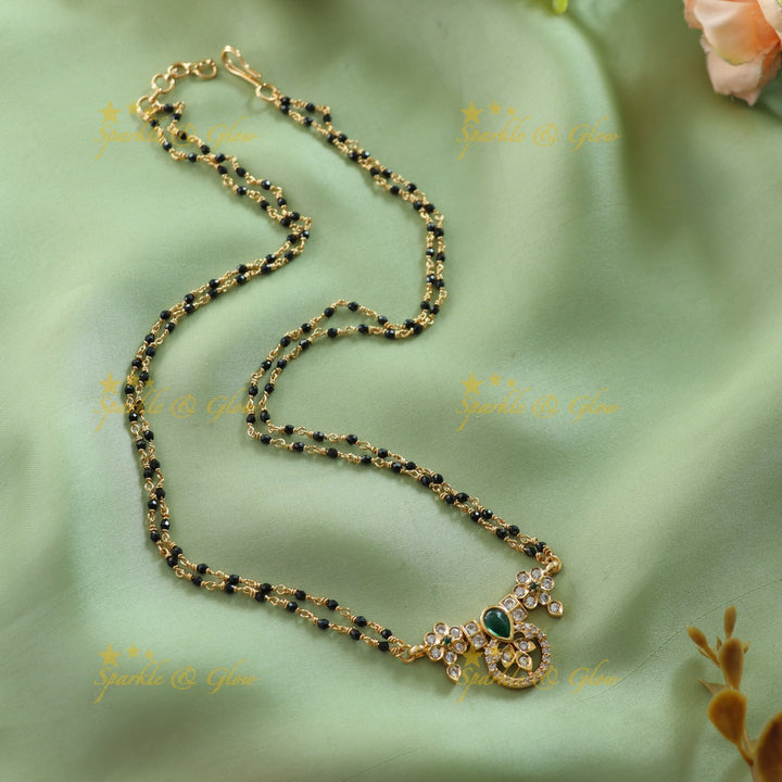 Elegant Floral design stone pendant two layer black beads chain , mangalsutra with emerald - green
