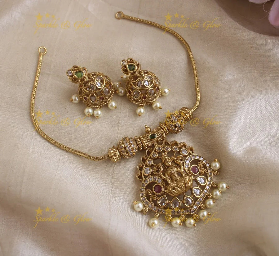 Glittering Idol Lakshmi peacock pendant short necklace with AD stones - Sparkle and Glow