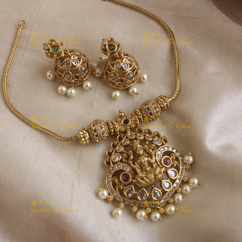 Glittering Idol Lakshmi peacock pendant short necklace with AD stones - Sparkle and Glow