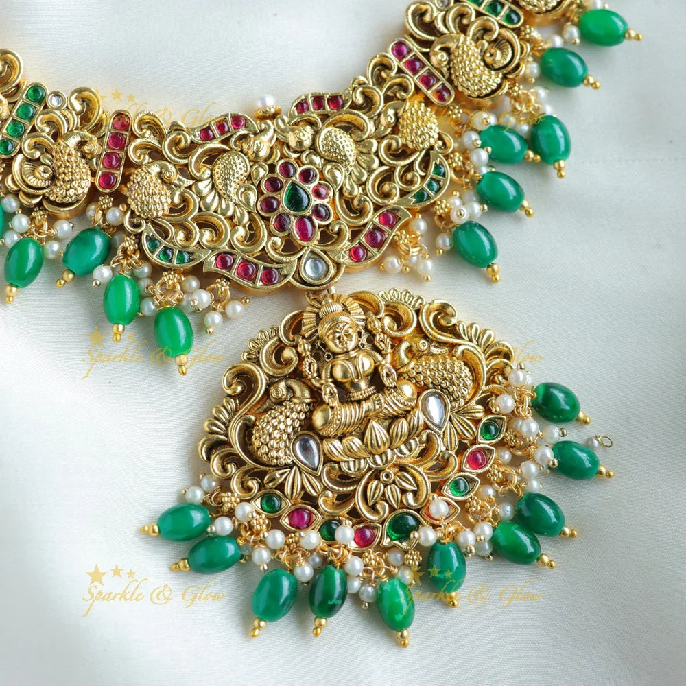 Beautiful Lakshmi peacock carved short necklace with ruby emerald and green beads - Sparkle and Glow