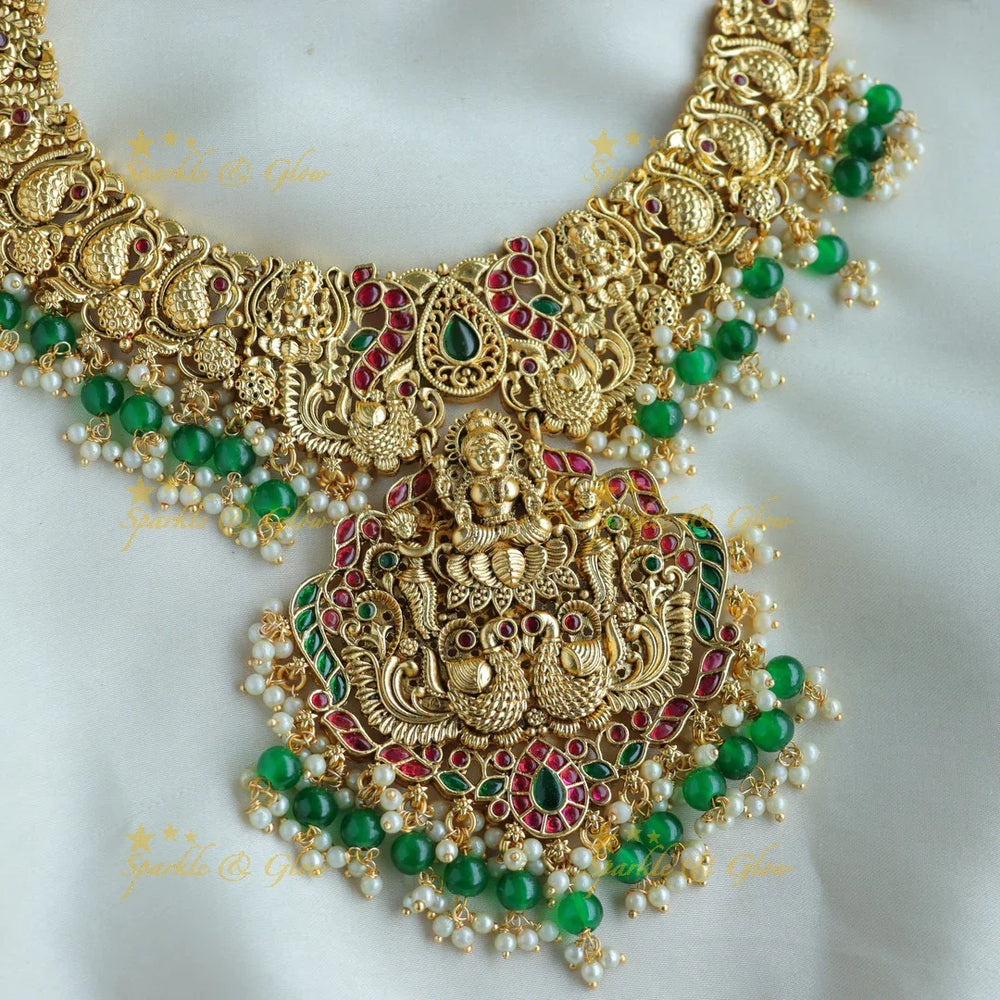 Statement Lakshmi peacock carved short necklace with ruby emerald and green beads - Sparkle and Glow