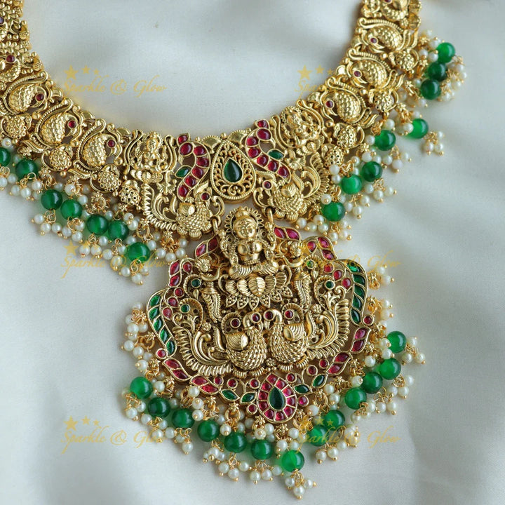 Statement Lakshmi peacock carved short necklace with ruby emerald and green beads - Sparkle and Glow