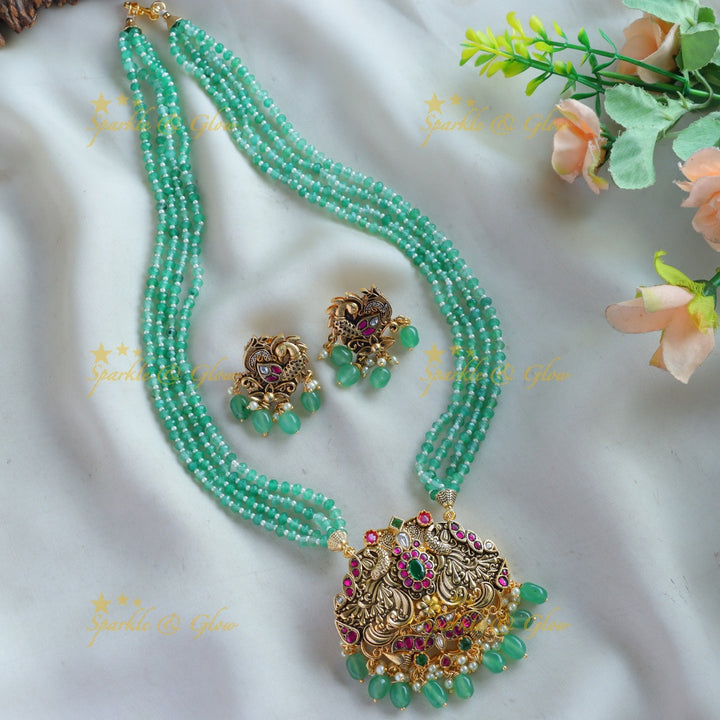 Stunning Peacock carved floral design pendant haram with multi layer mint green beads chain