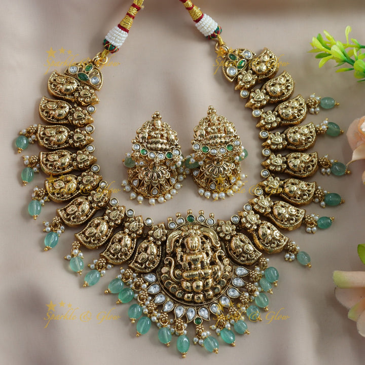 Beautiful Lakshmi carved mango short necklace with ruby stones gold beads - red gold