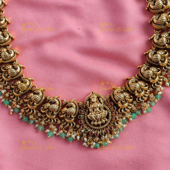 Grand Intricate Lakshmi peacock carved long necklace with gold beads - Sparkle and Glow