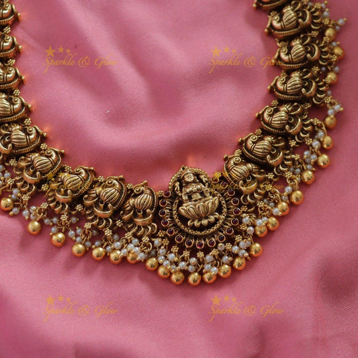Grand Intricate Lakshmi peacock carved long necklace with gold beads - Sparkle and Glow