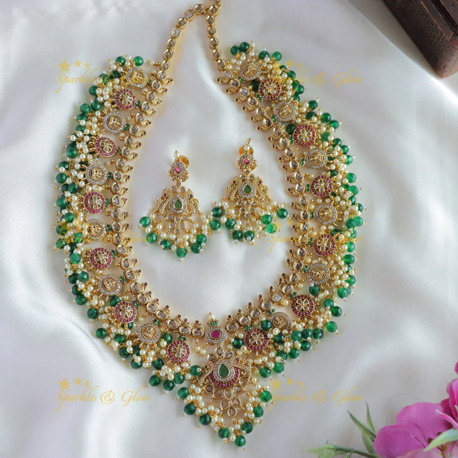 Statement Lakshmi peacock coin gutta pusalu long necklace with ruby emerald ang green beads - Sparkle and Glow