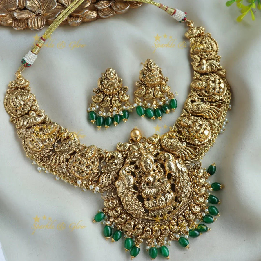 Gorgeous Lakshmi peacock carved short necklace with pearls and green beads - Sparkle and Glow