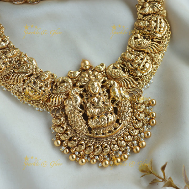 Gorgeous Lakshmi peacock carved short necklace with pearls and gold beads