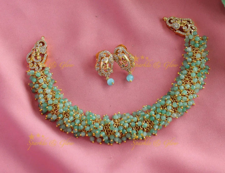 Gracious gold alike cluster Emerald beaded short necklace with Elephant Earrings - Sparkle and Glow