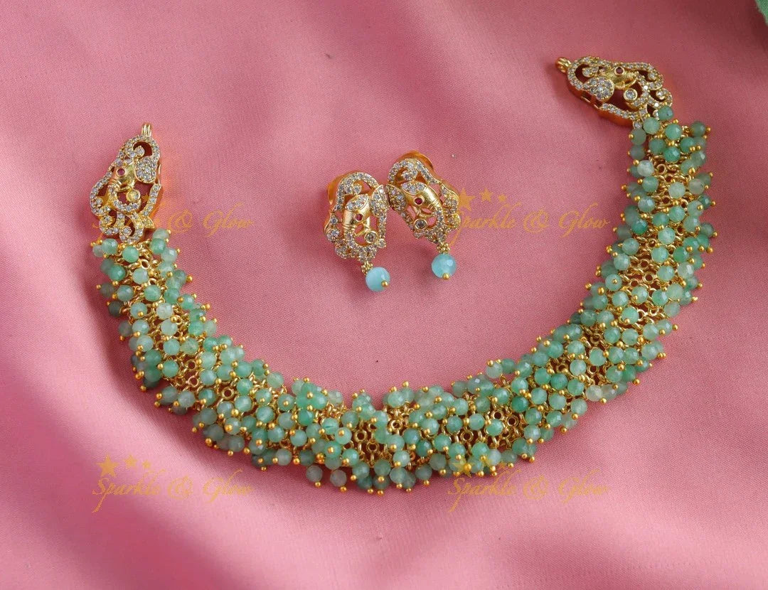 Gracious gold alike cluster Emerald beaded short necklace with Elephant Earrings - Sparkle and Glow