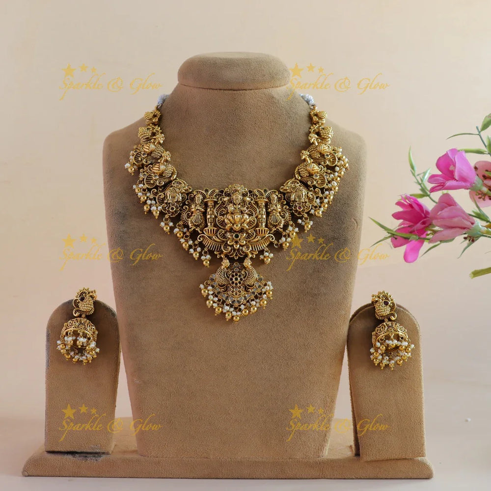 Beautiful Lakshmi peacock carved short necklace with stones pearls and gold beads - Sparkle and Glow