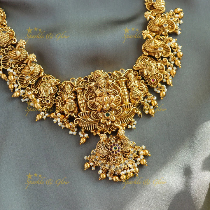 Beautiful Lakshmi peacock carved short necklace with stones pearls and gold beads - Sparkle and Glow