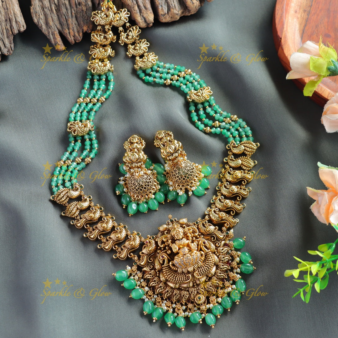 Exclusive Lakshmi peacock carved haram with ruby emerald and multi layer mint green beads chain